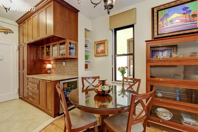 New York City Real Estate | View 433 WEST 24TH STREET, 3A | Dining Area with Custom Bar and Wine Refrigerator | View 5