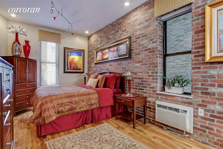 New York City Real Estate | View 433 WEST 24TH STREET, 3A | Spacious Bedroom with Exposed Brick | View 2