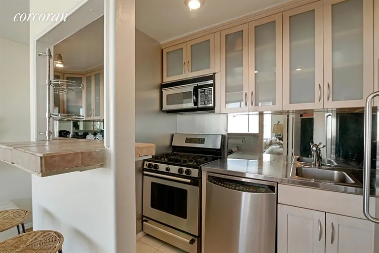 New York City Real Estate | View 353 East 72Nd Street, 24D | Renovated Kitchen with Stainless Steel Appliances | View 3