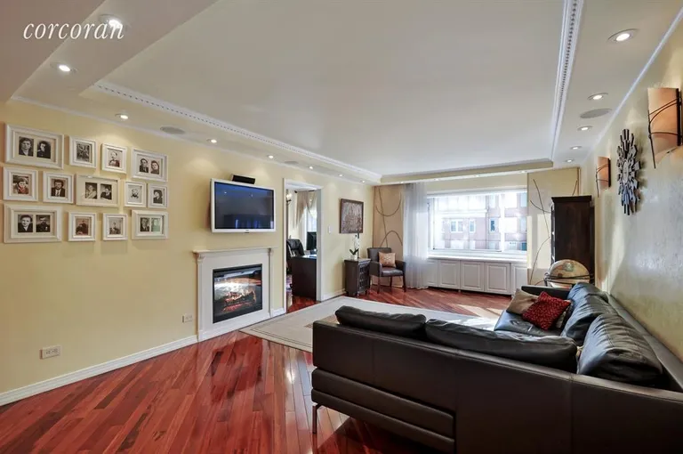 New York City Real Estate | View 200 East 78th Street, 6BC | Living Room with In Wall Fireplace | View 2