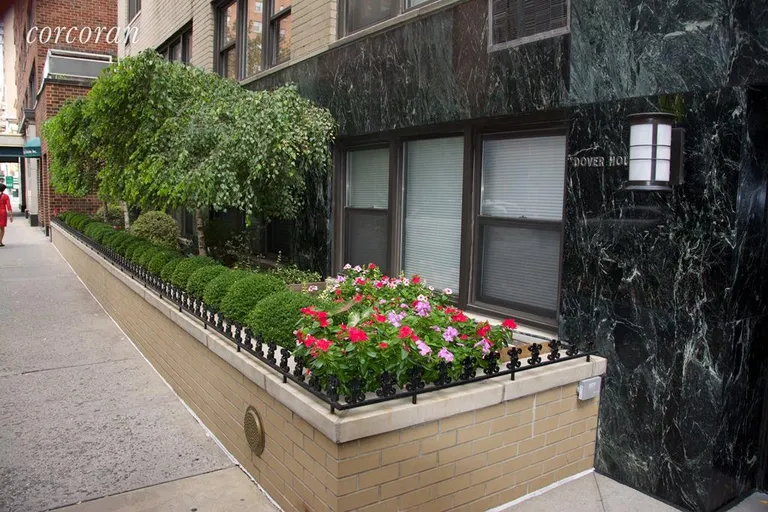 New York City Real Estate | View 205 East 77th Street, 9A | Flowers and Greenery Flank the Entrance | View 12