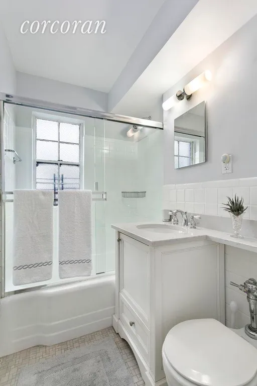 New York City Real Estate | View 205 East 77th Street, 9A | Windowed Master Bath with Marble Vanity | View 6