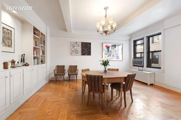 New York City Real Estate | View 135 Eastern Parkway, 13G | Formal Dining Room with Library and Cabinets | View 5