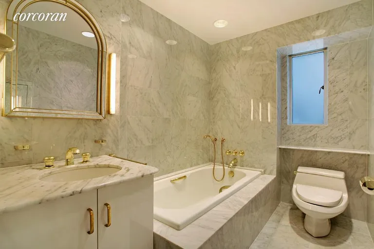 New York City Real Estate | View 25 Central Park West, 9AD | Marble Windowed Bath with Tub and Separate Shower | View 7
