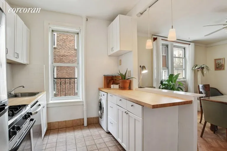New York City Real Estate | View 2022 Beverley Road, 12 | Cook and command the party from the open kitchen | View 4