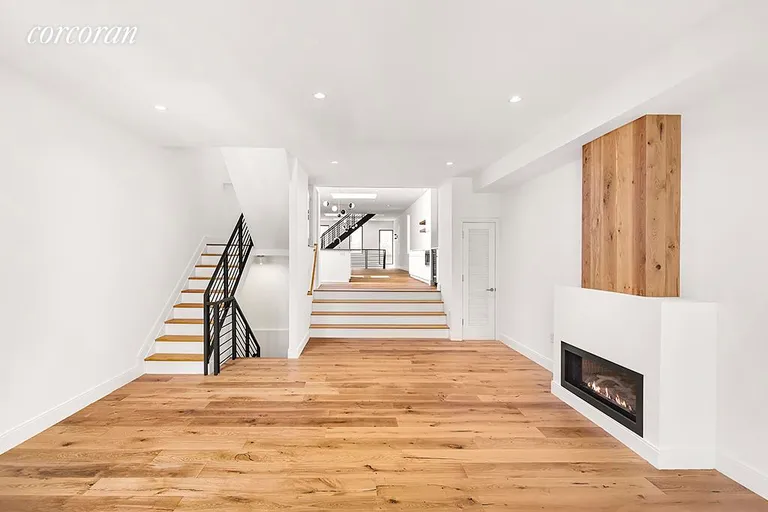 New York City Real Estate | View 226 Pacific Street | Living room with steps up to kitchen & dining room | View 5