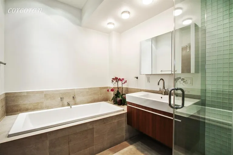 New York City Real Estate | View 11 East 22nd Street, 7TH FL | Master Bathroom with soaking tub and shower stall | View 6