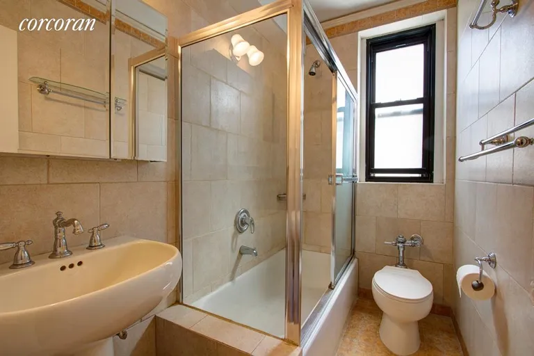 New York City Real Estate | View 172 West 79th Street, 11F | Windowed bathroom w/ glass enclosed tub/shower | View 4