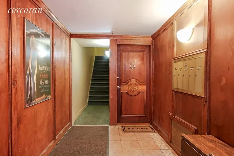 New York City Real Estate | View 326 West 19th Street | Wood paneled foyer | View 2
