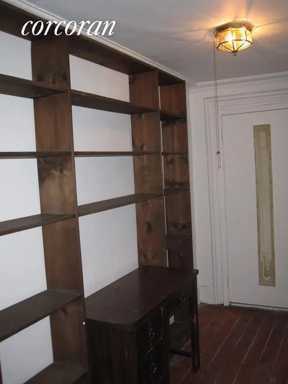 New York City Real Estate | View 169 Bergen Street, 1 | Foyer with Book Shelves | View 5