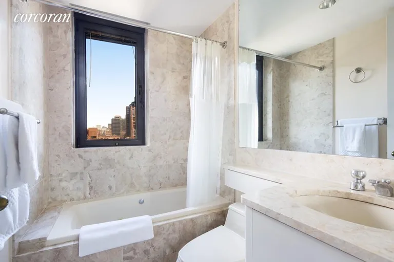 New York City Real Estate | View 100 United Nations Plaza, 17G | Windowed Marble Master Bathroom | View 6