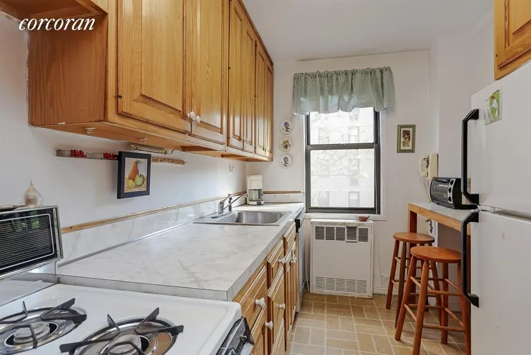 New York City Real Estate | View 241 East 76th Street, 5D | Windowed Kitchen w/countertop for 2 stools | View 4