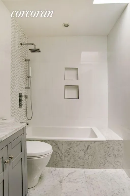 New York City Real Estate | View 704A Evergreen Avenue | Full bath with skylight | View 5