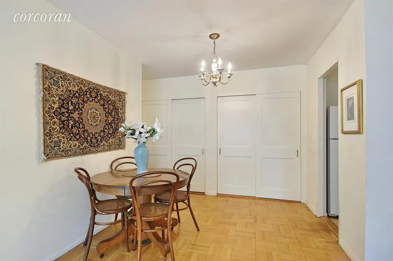 New York City Real Estate | View 144 East 84th Street, 8G | Dining area with wall of closets behind | View 4