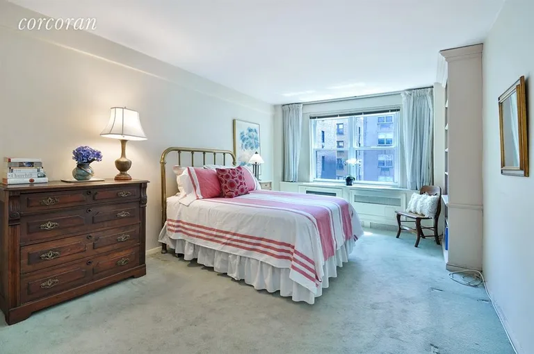 New York City Real Estate | View 144 East 84th Street, 8G | Spacious bedroom with built-in bookcase | View 5