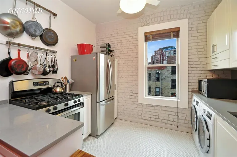 New York City Real Estate | View 237 West 11th Street, 6A | Pristinely renovated kitchen facing east  | View 3