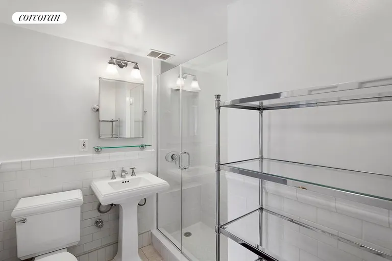 New York City Real Estate | View 241 Sixth Avenue, 7G | Large bathroom with glass-enclosed shower | View 4