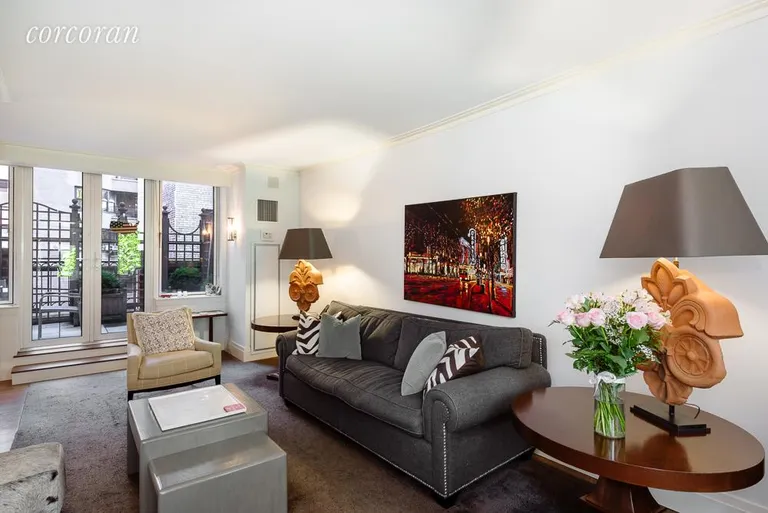 New York City Real Estate | View 188 East 78th Street, 5E | Living Room open to Private Terrace | View 2