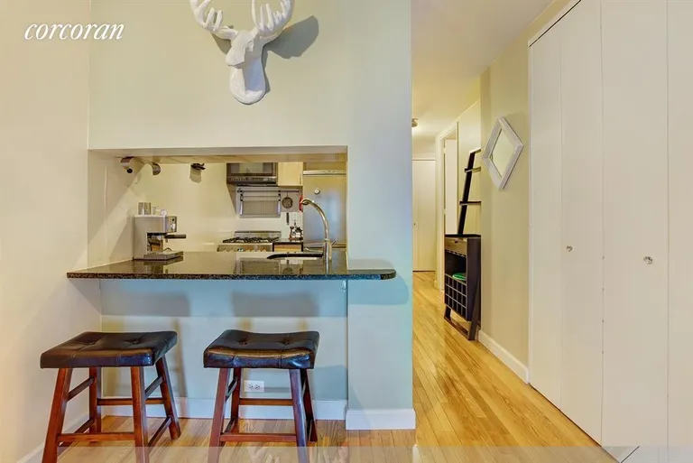 New York City Real Estate | View 350 West 50th Street, 3HH | Kitchen open to Living via breakfast counter | View 4