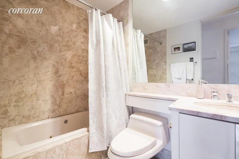 New York City Real Estate | View 100 United Nations Plaza, 16C | Marble Bathroom | View 5