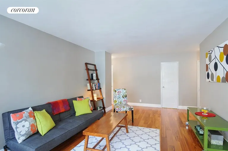 New York City Real Estate | View 303 West 66th Street, 2KW | LR - (towards hallway) accent new hardwood floors | View 4