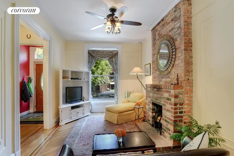 New York City Real Estate | View 514 6th Avenue | Parlor Living Room with Exposed Brick Fireplace | View 4