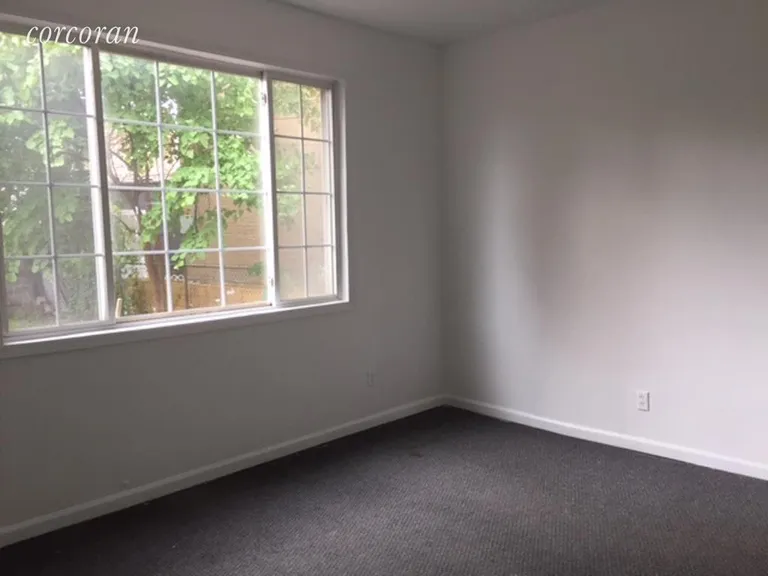 New York City Real Estate | View 279 23rd Street, 1 | Large back Bedroom view of Garden | View 3