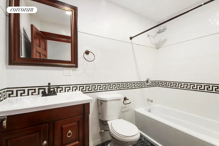 New York City Real Estate | View 412 Bainbridge Street, GRDN | Tiled Bathroom | View 7