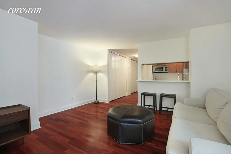 New York City Real Estate | View 88 Greenwich Street, 1316 | Large living room with pass-through kitchen | View 2