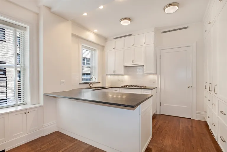 New York City Real Estate | View 215 West 88th Street, 8H | Open windowed kitchen with bar for casual dining | View 4