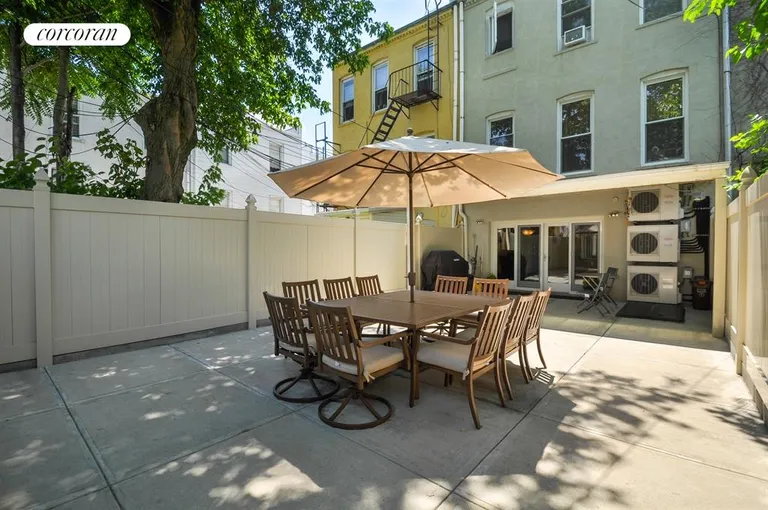 New York City Real Estate | View 571 73rd Street | Spacious Rear Yard with Canopy for Outdoor Living | View 7