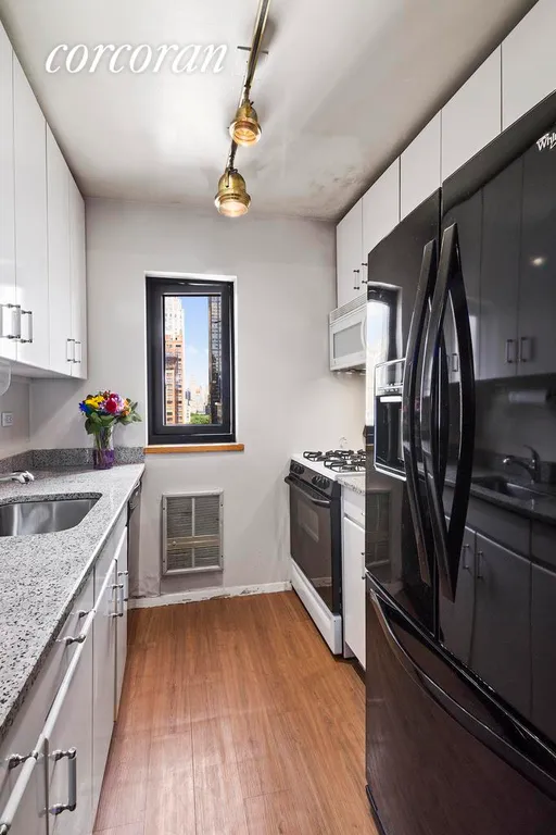New York City Real Estate | View 161 West 61st Street, 17F | Windowed Kitchen | View 4