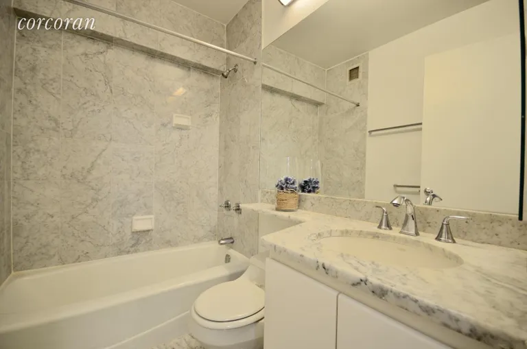 New York City Real Estate | View 45 East 25th Street, 11E | Marble Bathroom with Full Sized Bathtub and Shower | View 2
