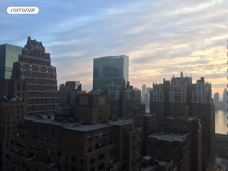 New York City Real Estate | View 250 East 40th Street, 26E | Beautiful evening sky & East River view | View 9