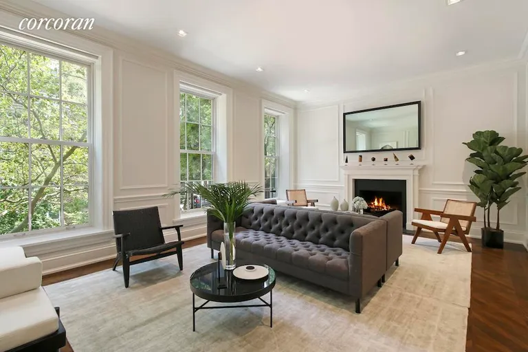 New York City Real Estate | View 27 Monroe Place | Parlor floor living room with fireplace | View 2