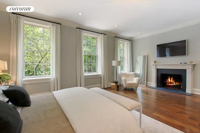 New York City Real Estate | View 27 Monroe Place | Master bedroom with fireplace | View 15