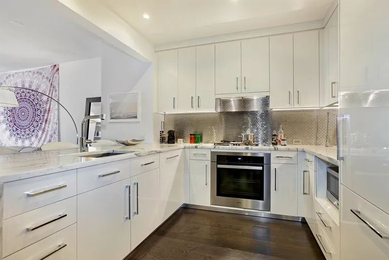 New York City Real Estate | View 50 Riverside Boulevard, 5E | White lacquer cabinetry & honed marble countertops | View 3