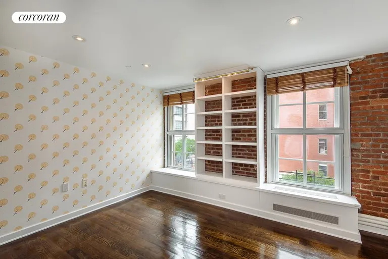New York City Real Estate | View 62 Beach Street, 4E | Bedroom with Brick Wall | View 6