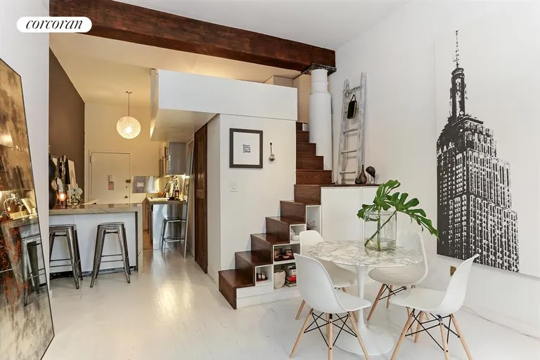 New York City Real Estate | View 23 Waverly Place, 3R | Breakfast bar and storage under the staircase | View 3