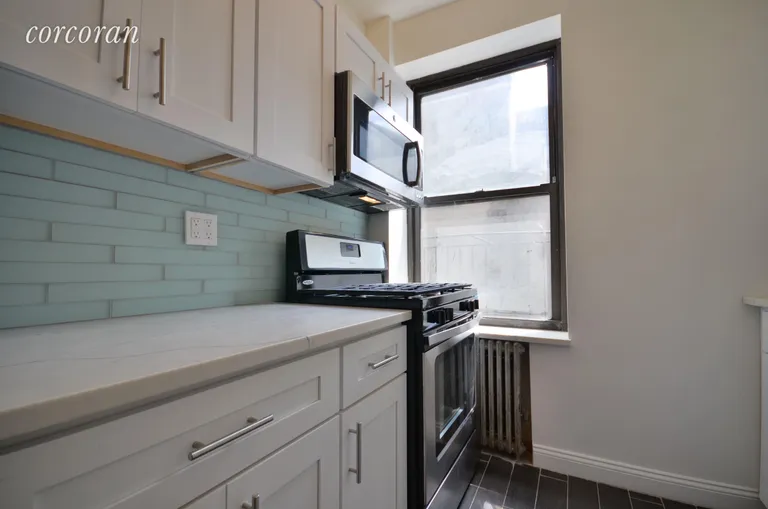 New York City Real Estate | View 202 Thompson Street, 23 | Windowed Kitchen is Fully Renovated  | View 4