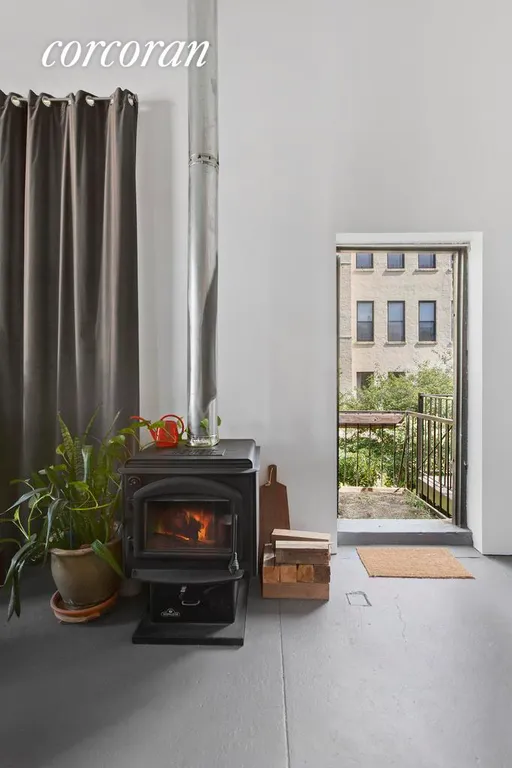 New York City Real Estate | View 603 Bergen Street, 204 | Wood stove and small patio make the space cozy. | View 4