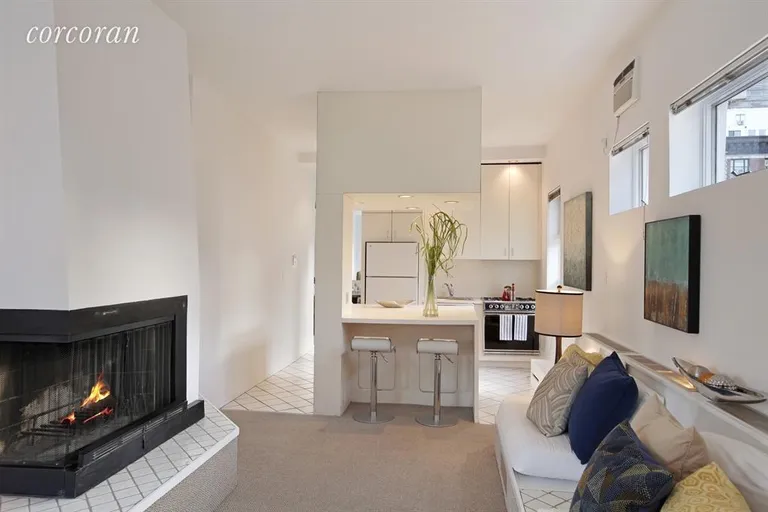 New York City Real Estate | View 120 West 70th Street, PH A/B | Living Room and Kitchen | View 4