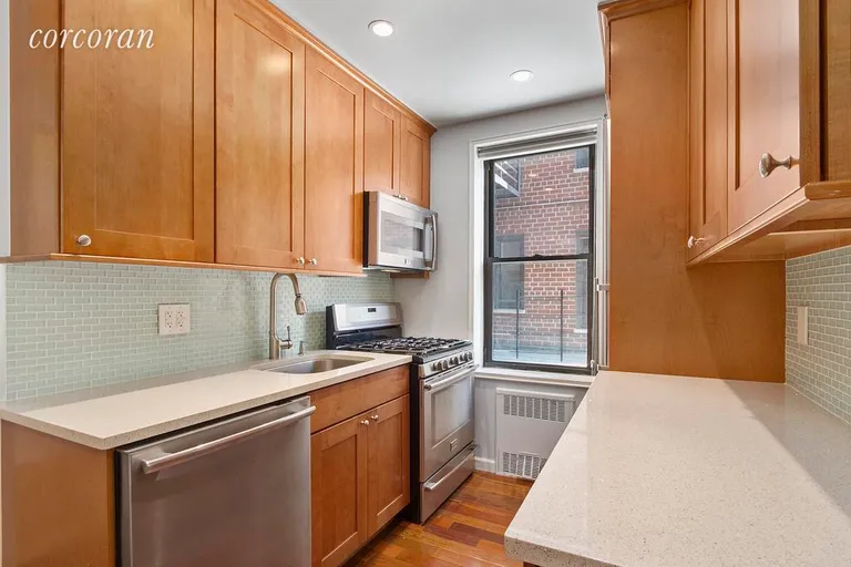 New York City Real Estate | View 30 East 9th Street, 2BB | Windowed chef's kitchen open to Living Room! | View 3