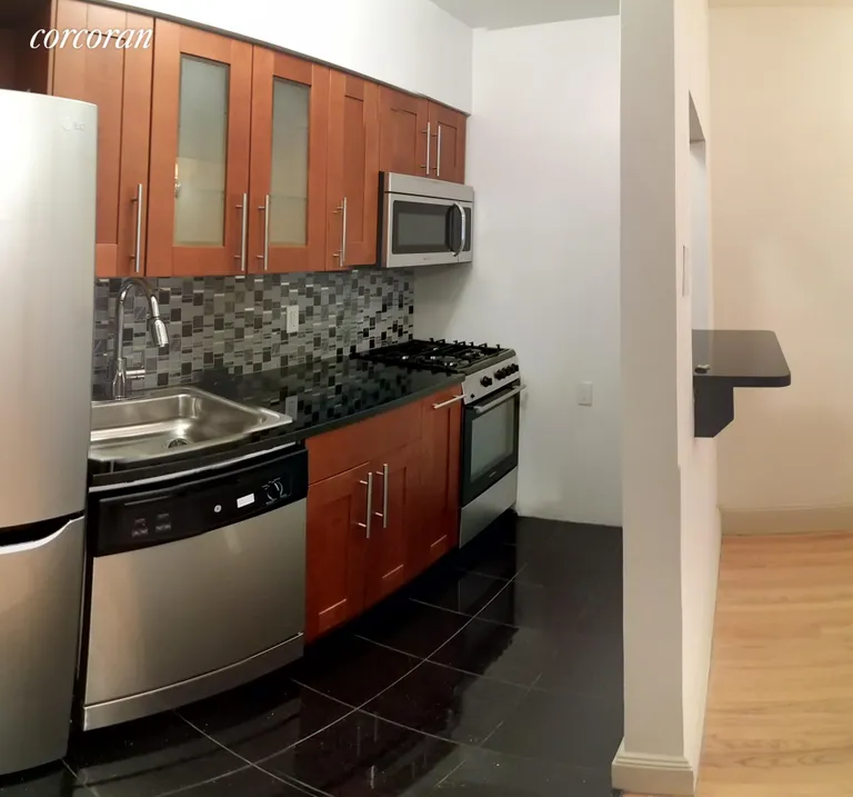New York City Real Estate | View 38 West 69th Street, A | Beautifully renovated pass through Kitchen | View 2