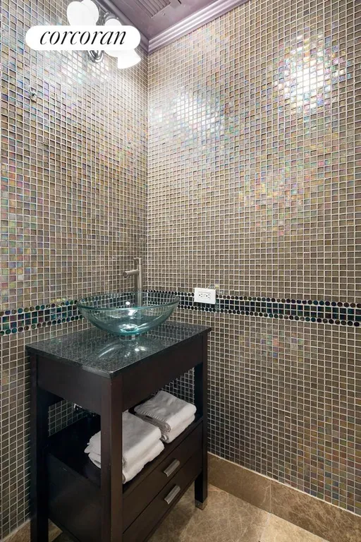 New York City Real Estate | View 45 Park Avenue, 804 | Bisazza tile Powder Room | View 7