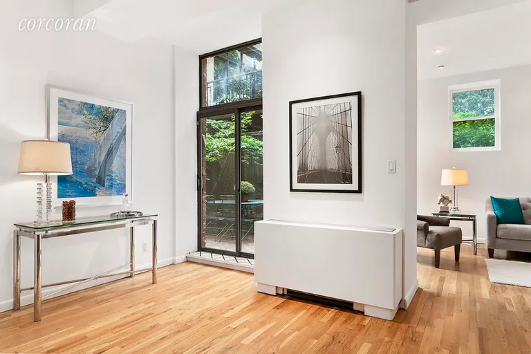 New York City Real Estate | View 141 West 13th Street, 104 | Den with garden views | View 4