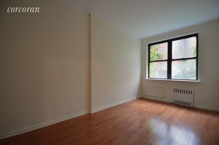 New York City Real Estate | View 222 East 75th Street, 1E | Large bedroom with full sized closet.  | View 5