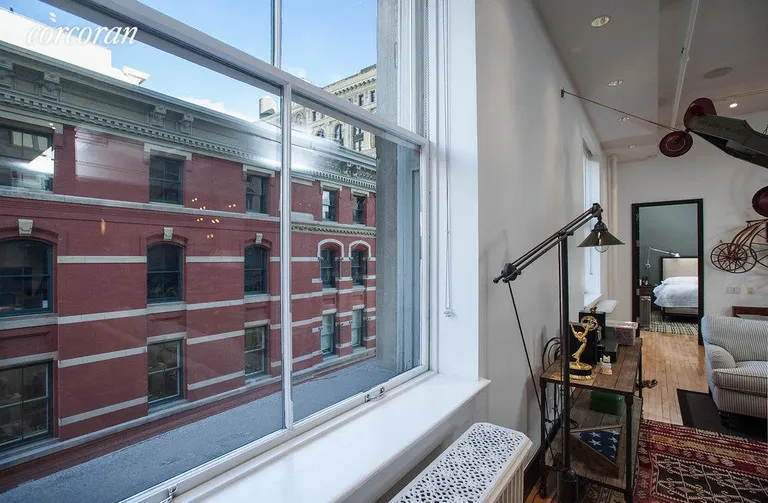 New York City Real Estate | View 565 Broadway, 5W | Living room widnows | View 11