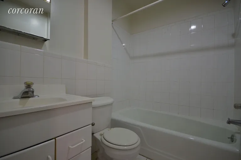 New York City Real Estate | View 11 Varick Street, 5M | Renovated Bathroom and Tile Flooring | View 4