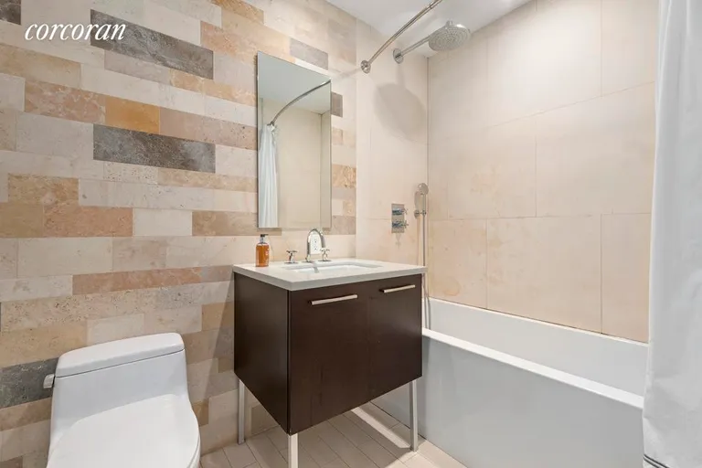 New York City Real Estate | View 130 West 20th Street, 7A | Pristine Bathroom with Rain Shower | View 4